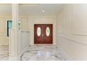 Bright entryway with marble floors and elegant double doors at 756 Bowman Ter, Port Charlotte, FL 33953