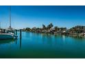 Stunning waterfront view with boats and lush tropical foliage at 550 Johns Pass Ave, Madeira Beach, FL 33708