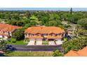 Beautiful townhomes with terracotta roofs, garages, and landscaped yards in a gated community with golf course views at 6251 Vista Verde W Dr, St Petersburg, FL 33707