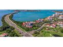 Beautiful coastal condo complex with waterfront views, lush landscaping, and a nearby golf course at 6365 Bahia Del Mar Blvd # 105, St Petersburg, FL 33715