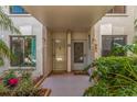Inviting condo entrance featuring well-maintained landscaping and a cozy, private entryway at 6365 Bahia Del Mar Blvd # 105, St Petersburg, FL 33715