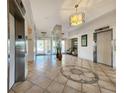 Lobby with elevators, seating, and tiled floors at 851 Bayway Blvd # 205, Clearwater Beach, FL 33767