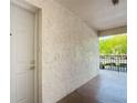 View of the front door, showcasing the secure entry and well-maintained exterior at 8174 Terrace Garden N Dr # 207, St Petersburg, FL 33709