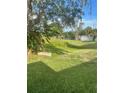 Expansive backyard with lush greenery and mature trees offering shade at 3357 38Th S St # A, St Petersburg, FL 33711