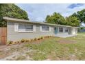 Updated ranch home with a landscaped front yard and attached garage at 3505 75Th N St, St Petersburg, FL 33710