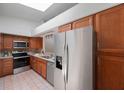 Modern kitchen featuring stainless steel appliances and ample cabinetry at 842 Amelia Ne Ct, St Petersburg, FL 33702