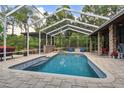 Refreshing pool with covered patio and ample space for lounging at 3204 Polo Pl, Plant City, FL 33566