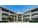 Attractive building exterior with arched entryway at 2228 Swedish Dr # 42, Clearwater, FL 33763