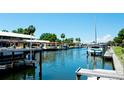 Picturesque waterfront showcasing boat docks, yachts, and vibrant blue waters, offering serene coastal living at 4216 La Costa Cv # 4216, Bradenton, FL 34210