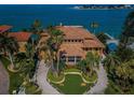 Luxury home with terracotta roof and beachfront location at 806 Columbus Dr, Tierra Verde, FL 33715