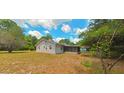 Single story home with a screened porch and large backyard at 8194 Wpa Rd, Brooksville, FL 34601