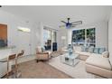 Living room with sectional sofa and large window at 10590 Windsor Lake Ct # 0, Tampa, FL 33626