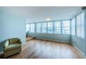 Sunlit living room with hardwood floors and water views at 5130 Brittany S Dr # 202, St Petersburg, FL 33715