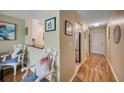 Condo entryway with wood floors, kitchen, and living area visible at 900 Cove Cay Dr # 1H, Clearwater, FL 33760