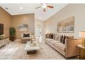 Virtually staged living room featuring a neutral color scheme and ample seating at 1802 Wood Brook St, Tarpon Springs, FL 34689