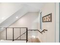 Bright landing with metal railing and window overlooking backyard at 372 6Th S St # 12, St Petersburg, FL 33701