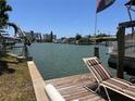 Relaxing waterfront view with a lounge chair at 14845 N Bayshore Dr, Madeira Beach, FL 33708