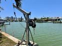 Private boat lift providing convenient access to the water at 14845 N Bayshore Dr, Madeira Beach, FL 33708