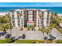 Oceanfront building with parking and tropical landscaping at 200 121St Ave # 101, Treasure Island, FL 33706