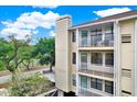 Building exterior with balconies and landscaping at 1000 W Horatio St # 212, Tampa, FL 33606