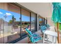 Spacious patio with sliding glass doors and seating area at 1 Key Capri # 104E, Treasure Island, FL 33706