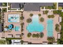 Community pool area with water features and lounge chairs at 31275 Spruceberry Ct, Wesley Chapel, FL 33543