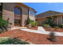 Brick home with large windows and double doors at 6109 Waters Way, Weeki Wachee, FL 34607