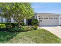 Charming one-story home with mature landscaping and a two-car garage at 11131 Hollander Ave, Hudson, FL 34667