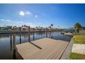 Private dock with composite decking overlooking the canal at 910 Spindle Palm Way, Apollo Beach, FL 33572