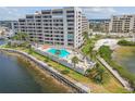 Waterfront condo complex has beautiful views, a pool, and a seating area on the shore at 6035 Sea Ranch Dr # 505, Hudson, FL 34667