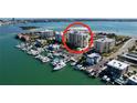 Aerial view of a waterfront building with a circular red highlight at 830 S Gulfview Blvd # 305, Clearwater Beach, FL 33767