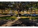 Front view of a two-story building with ample parking and landscaping at 2220 Spanish Dr # 36, Clearwater, FL 33763