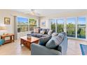 Living room with comfortable seating and access to balcony at 19610 Gulf Blvd # 409, Indian Shores, FL 33785