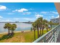 Stunning view from balcony overlooking a calm waterway and lush greenery at 8001 Sailboat Key S Blvd # 204, St Pete Beach, FL 33707