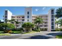 Condo building exterior showcasing a waterfront location and attractive design at 8001 Sailboat Key S Blvd # 204, St Pete Beach, FL 33707