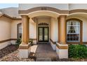 Inviting front entrance with columns and double doors at 1570 Preserve Way, Clearwater, FL 33764