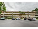 Two-story condo building with parking and landscaping at 2417 Persian Dr # 57, Clearwater, FL 33763