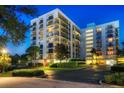 Well-maintained condominium with balconies, beautiful landscaping, and covered parking spaces at 150 Belleview Blvd # 704, Belleair, FL 33756