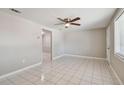 Spacious living room featuring tile floors and a ceiling fan at 3353 Columbus Dr, Holiday, FL 34691