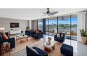 Spacious living room with water views and stylish furnishings at 2775 Kipps Colony S Dr # 204, St Petersburg, FL 33707
