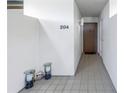 Condo entry with tile flooring and decorative accents at 2775 Kipps Colony S Dr # 204, St Petersburg, FL 33707