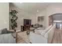 Living room features a sectional sofa and large TV at 17B Franklin S Ct, St Petersburg, FL 33711