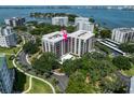 Aerial view of waterfront community, highlighting a specific building at 150 Belleview Blvd # 704, Belleair, FL 33756