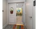 Inviting condo entryway with decorative basket at 150 Belleview Blvd # 704, Belleair, FL 33756