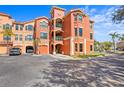 Front view of a three-story condo building with parking at 2746 Via Tivoli # 132B, Clearwater, FL 33764