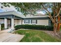 House exterior showcasing a well-maintained facade and landscaping at 1377 N Mcmullen Booth Rd # 1377, Clearwater, FL 33759