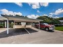 Reserved carport parking with additional guest parking nearby at 1377 N Mcmullen Booth Rd # 1377, Clearwater, FL 33759