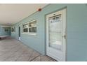 Charming condo exterior with a secure entrance and well-maintained walkway, offering a welcoming curb appeal at 6201 2Nd E St # 73, St Pete Beach, FL 33706