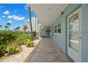 Condo exterior featuring lush landscaping, nearby condos and close beach access at 6201 2Nd E St # 73, St Pete Beach, FL 33706