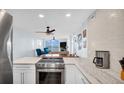 Modern kitchen with stainless steel appliances and waterfront views at 9 Haig Pl # 806, Dunedin, FL 34698